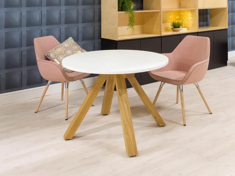 Café Table and Chairs Blush upholstered chairs at a round table with oak legs