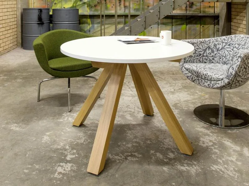 Café Table and Chairs Green lounge chairs at a round white table with oak legs