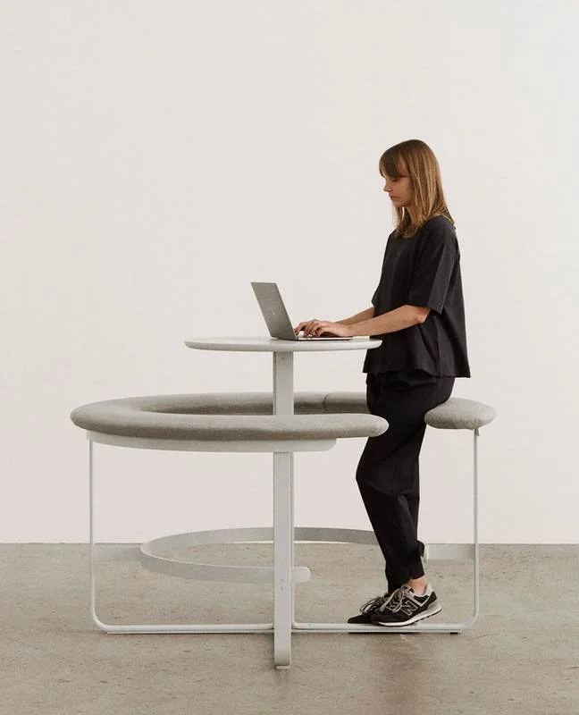 Standing Table with Bench White standing-height table with a curved perch bench