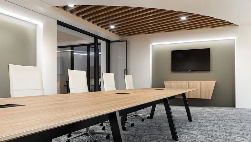 Conference Room Long wood conference table in a meeting room with display
