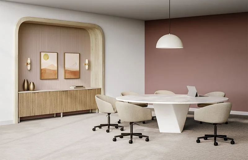 Round Conference Table Round conference table with bronze base inside a blush arched meeting room with credenza