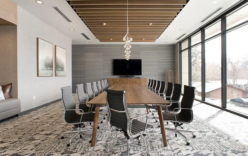 Boardroom Wood boardroom table with high-back chairs