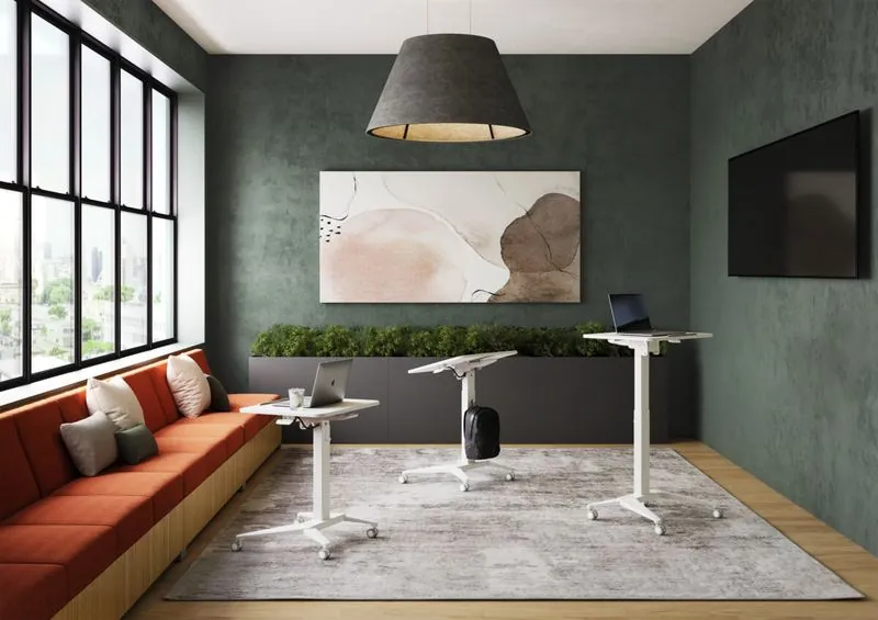 Adjustable Tables Adjustable-height tables in a green lounge with banquette seating