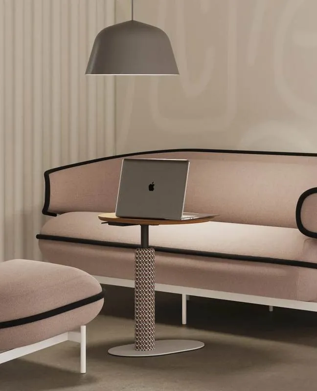 Adjustable Laptop Table Adjustable laptop table beside a pink sofa