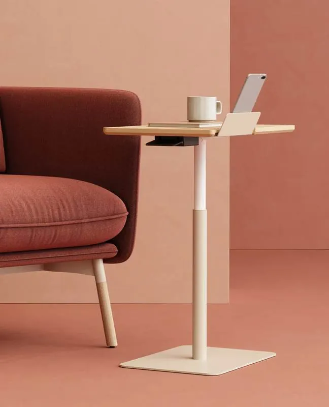 Adjustable Side Table Adjustable side table next to a lounge chair