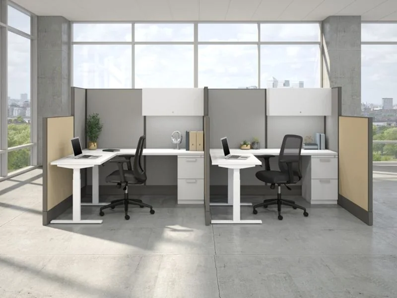 Height-Adjustable Desks White height-adjustable desks in gray panel workstations