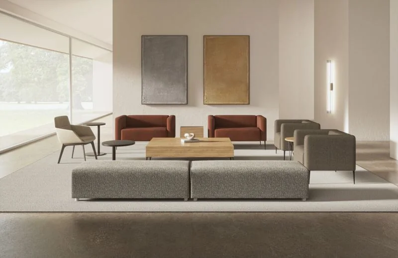 Beige and gray modular seating with wood tables