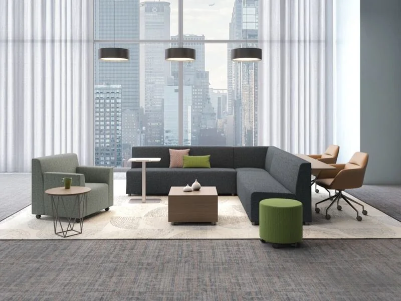 Charcoal modular seating with ottomans in a high-rise lounge
