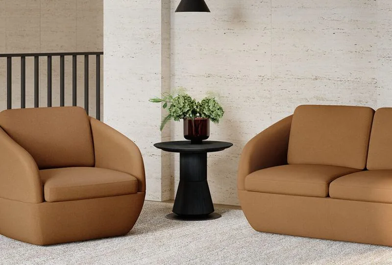 Cognac swivel lounge chairs with a black side table