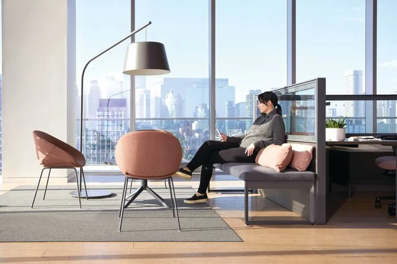 Coral lounge chairs in an open office