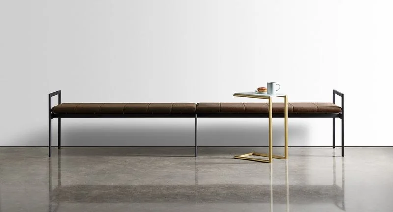 Dark wood bench with a slim side table
