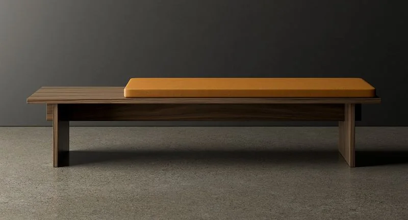 Dark wood bench with an ochre leather cushion