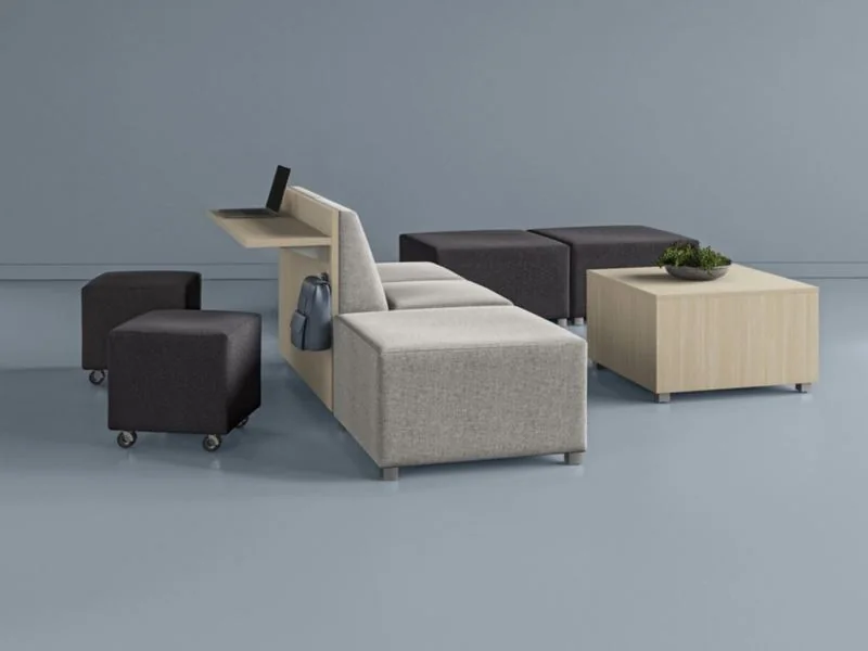 Gray and cream modular seating on a blue backdrop