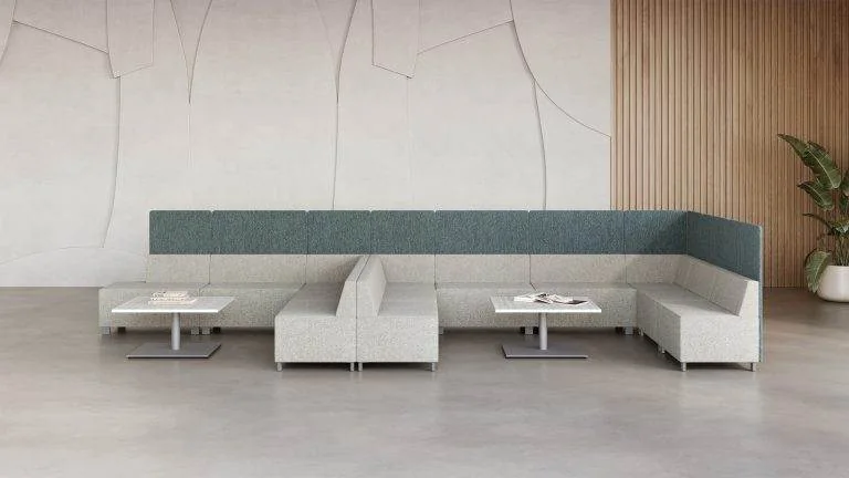 Gray and teal banquette along a stone wall