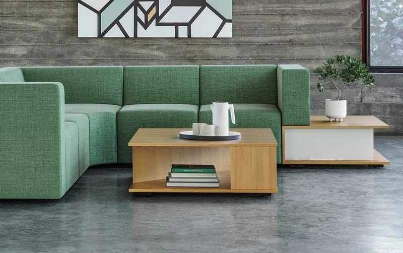 Green modular sofa with a wood coffee table