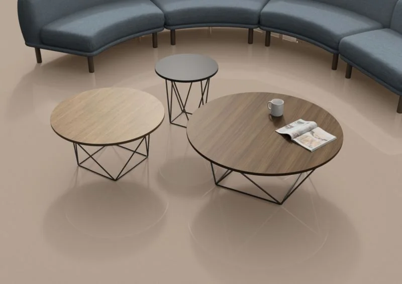 Navy curved sofa with wood-top tables