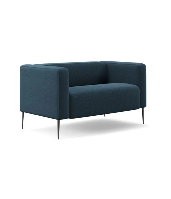 Navy upholstered armchair on slim legs