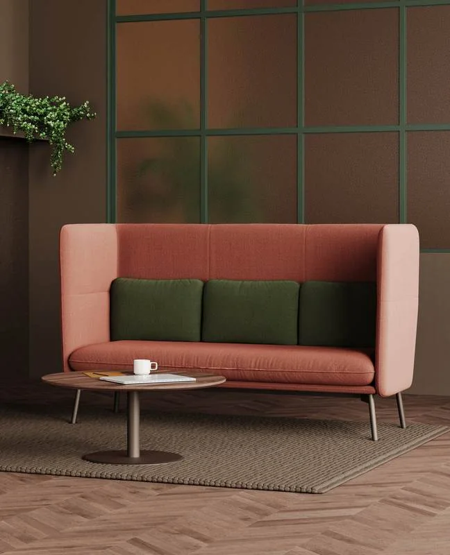Pink high-back sofa with olive cushions