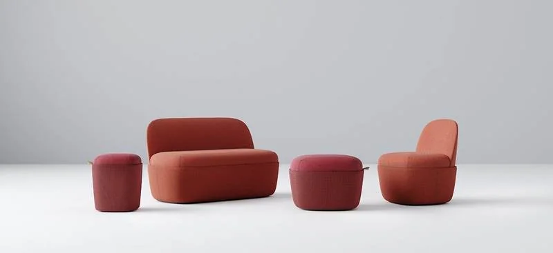 Red modular lounge pieces and poufs