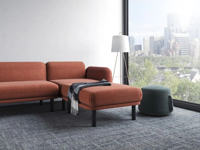 Rust sofa with chaise on a gray rug