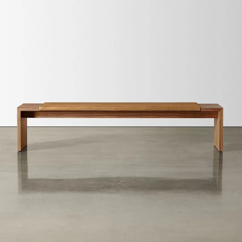 Solid wood bench on a polished concrete floor