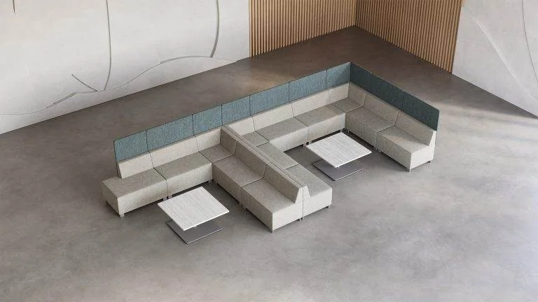 Teal and white modular seating with tablet arms