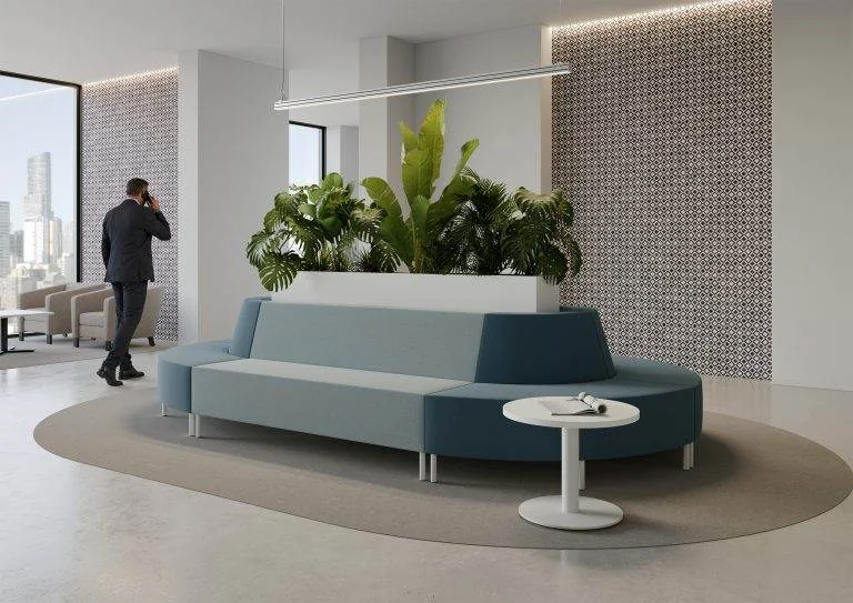 Teal curved seating with a built-in planter