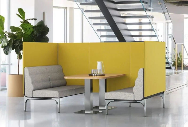 Yellow high-back lounge booth with a center table