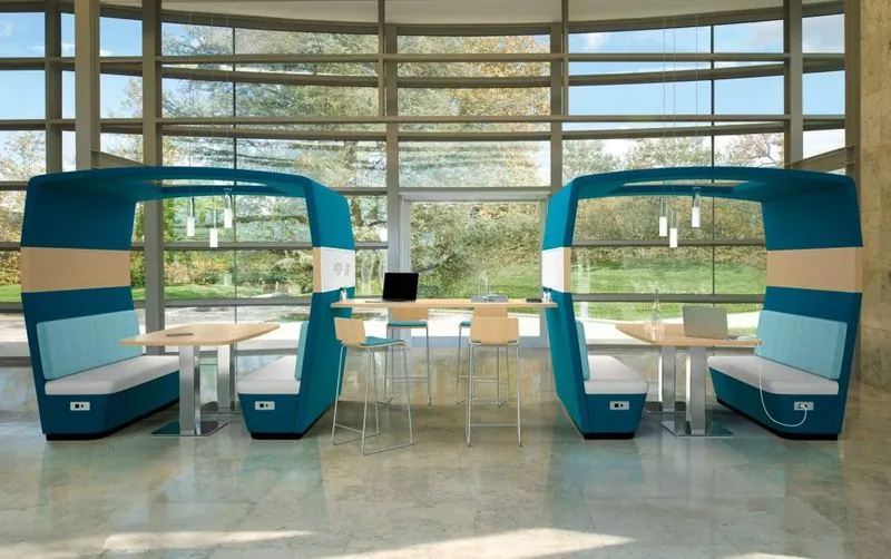Hooded Booths Teal hooded booth seating by a window