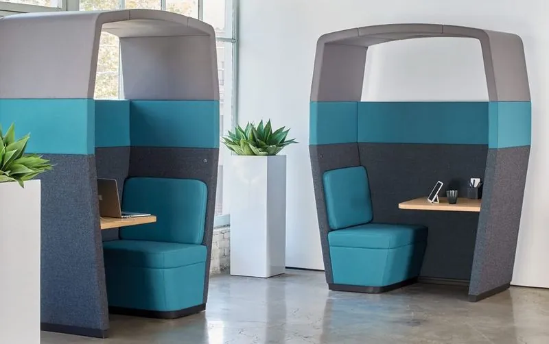 Hooded Booths Two teal hooded single booths with work surfaces