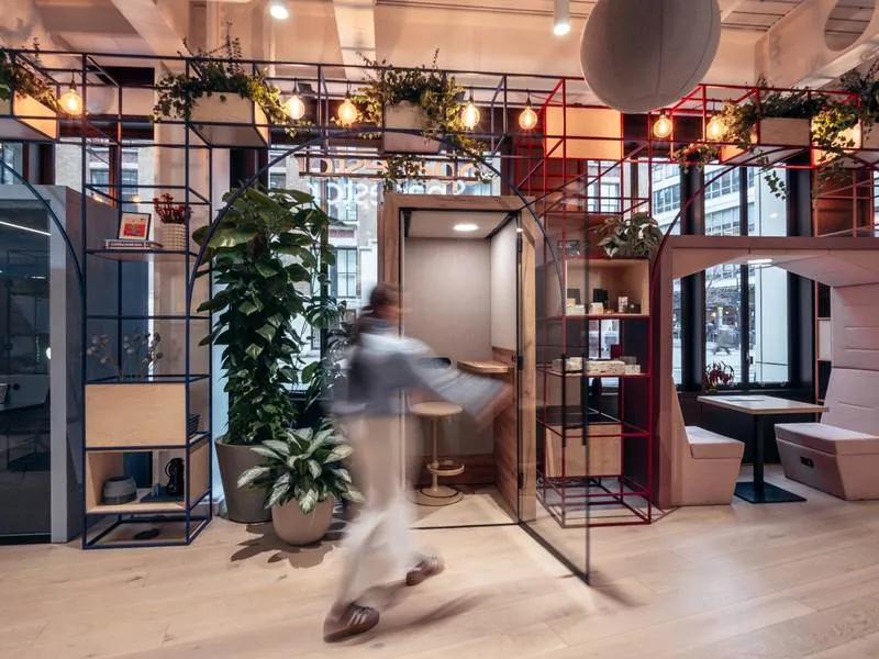 Phone Booth Wood-frame phone booth among planters in a modern office