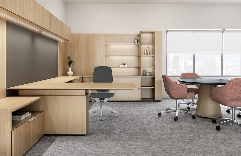 Executive Office Light wood executive office with L-shaped desk and round meeting table
