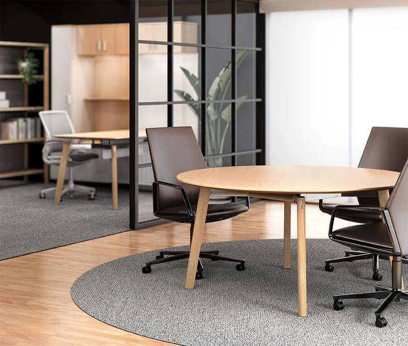 Executive Meeting Table Round meeting table with high-back chairs in an executive office