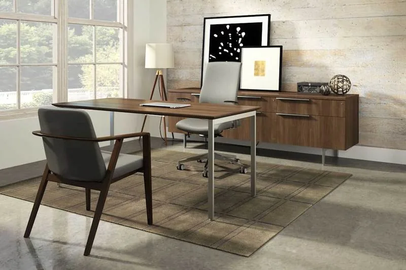 Walnut Executive Office Walnut executive desk and credenza beneath a gallery wall in soft daylight