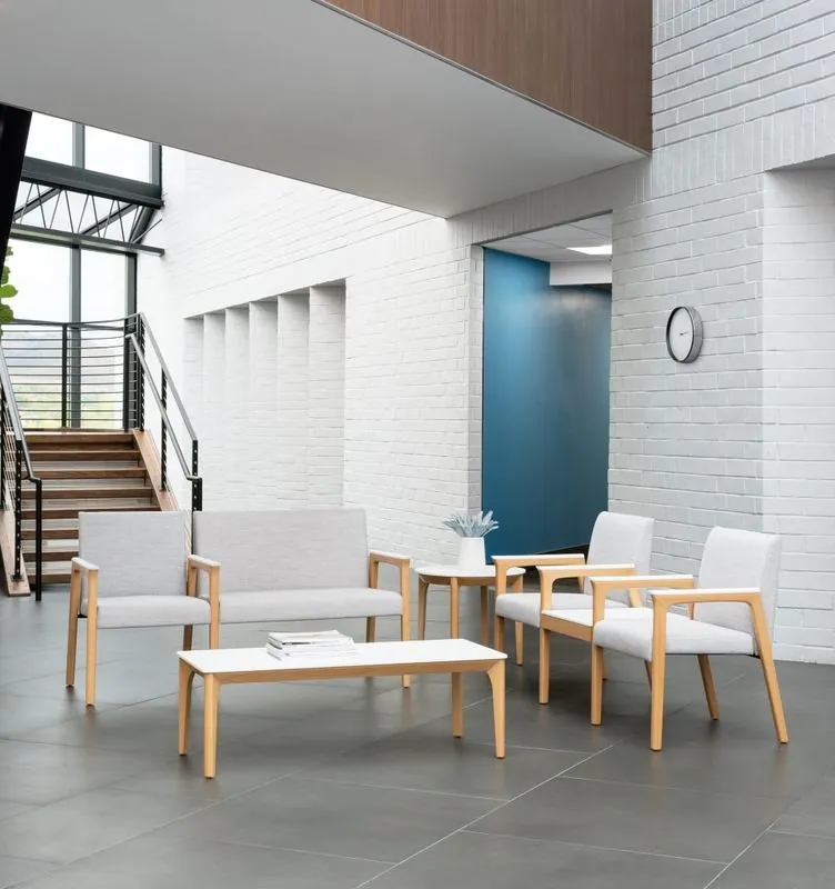 Lobby Seating Light wood lobby seating and coffee tables in a bright atrium