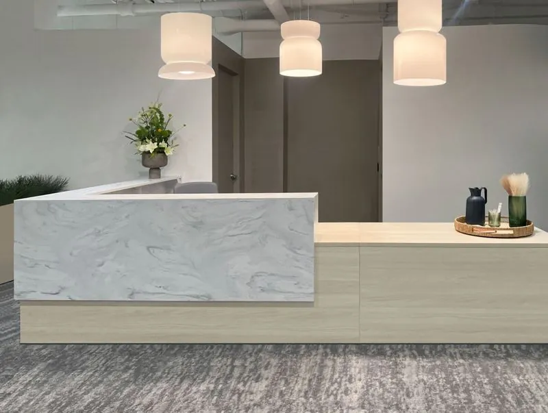 Reception Desk Reception desk with marble-look transaction top and pendant lights