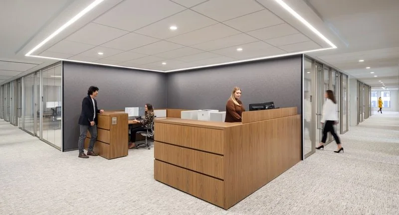 Reception Desk Walnut reception desk in a glass-walled lobby