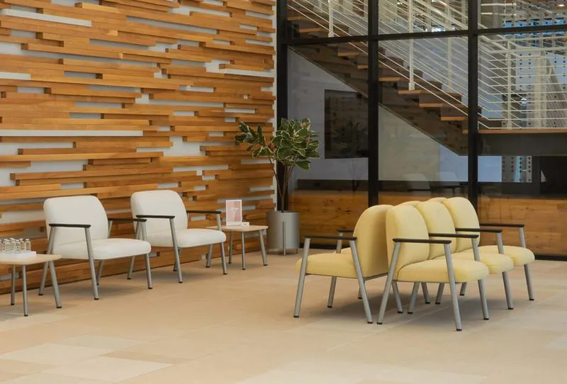 Lobby Waiting Area White and yellow waiting chairs against a reclaimed-wood wall