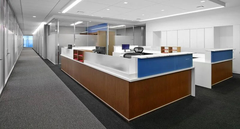 Reception Desk Wood reception desk with a white counter and blue accent panel