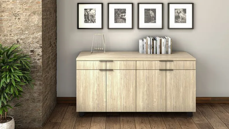 Light wood credenza with framed art above