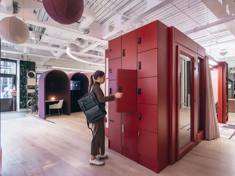 Red locker wall in a modern open office