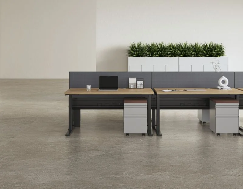 Benching Black-frame benching desks with pedestals and a planter wall