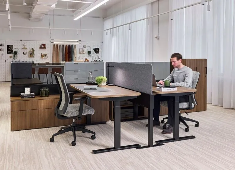 Open Office Height-adjustable workstations with privacy screens in an open office