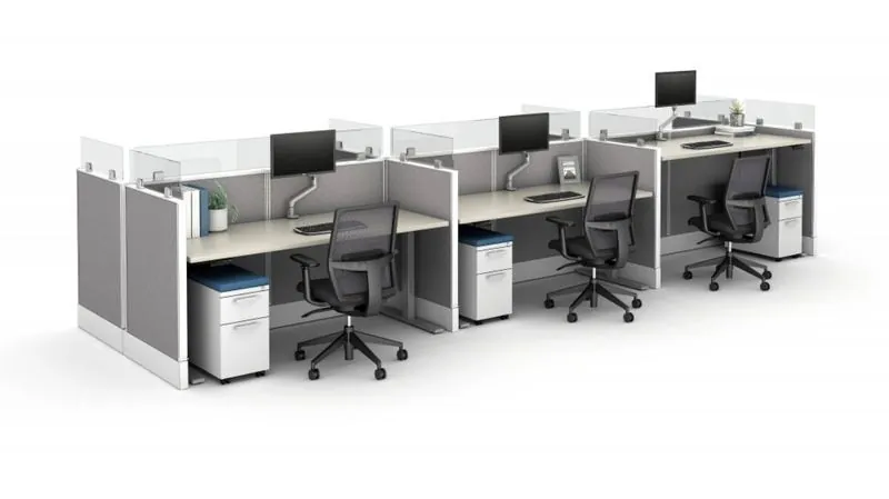 Cubicle Workstations Row of three cubicle workstations with gray panels