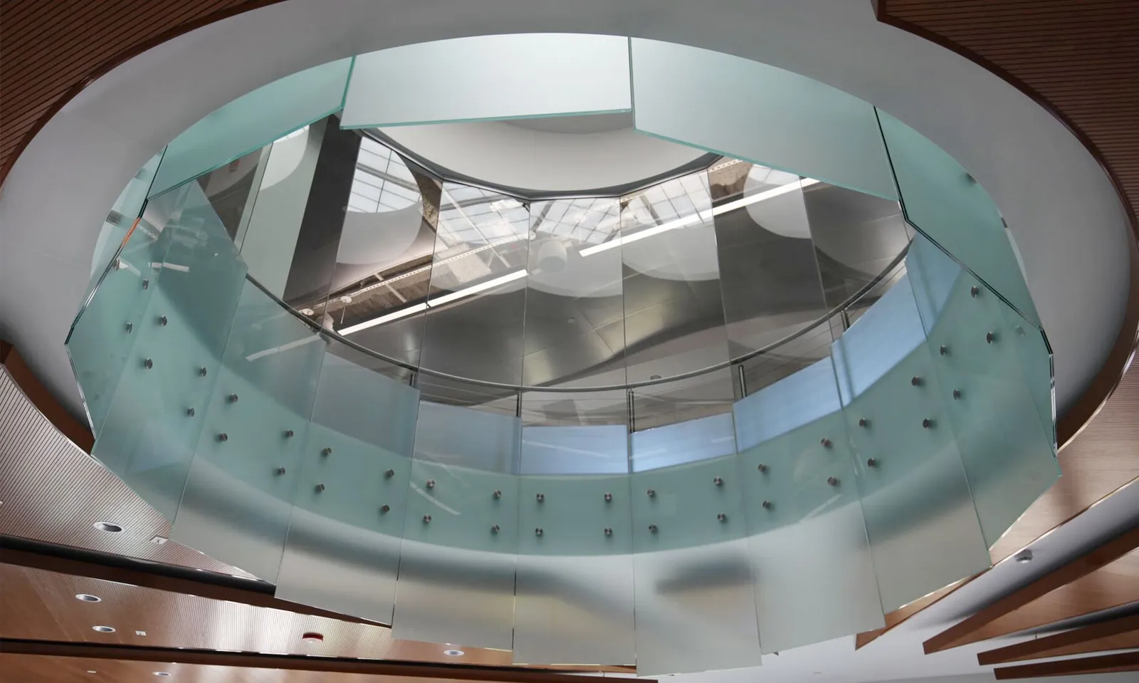 Curved Glass Curved glass atrium railing seen from below