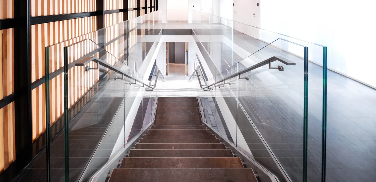 Glass Stair Railing Frameless glass stair railing with wood handrail