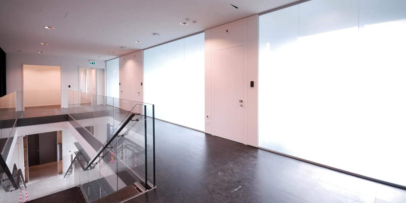 Glass Railing Glass stair railing and partitions in a bright office