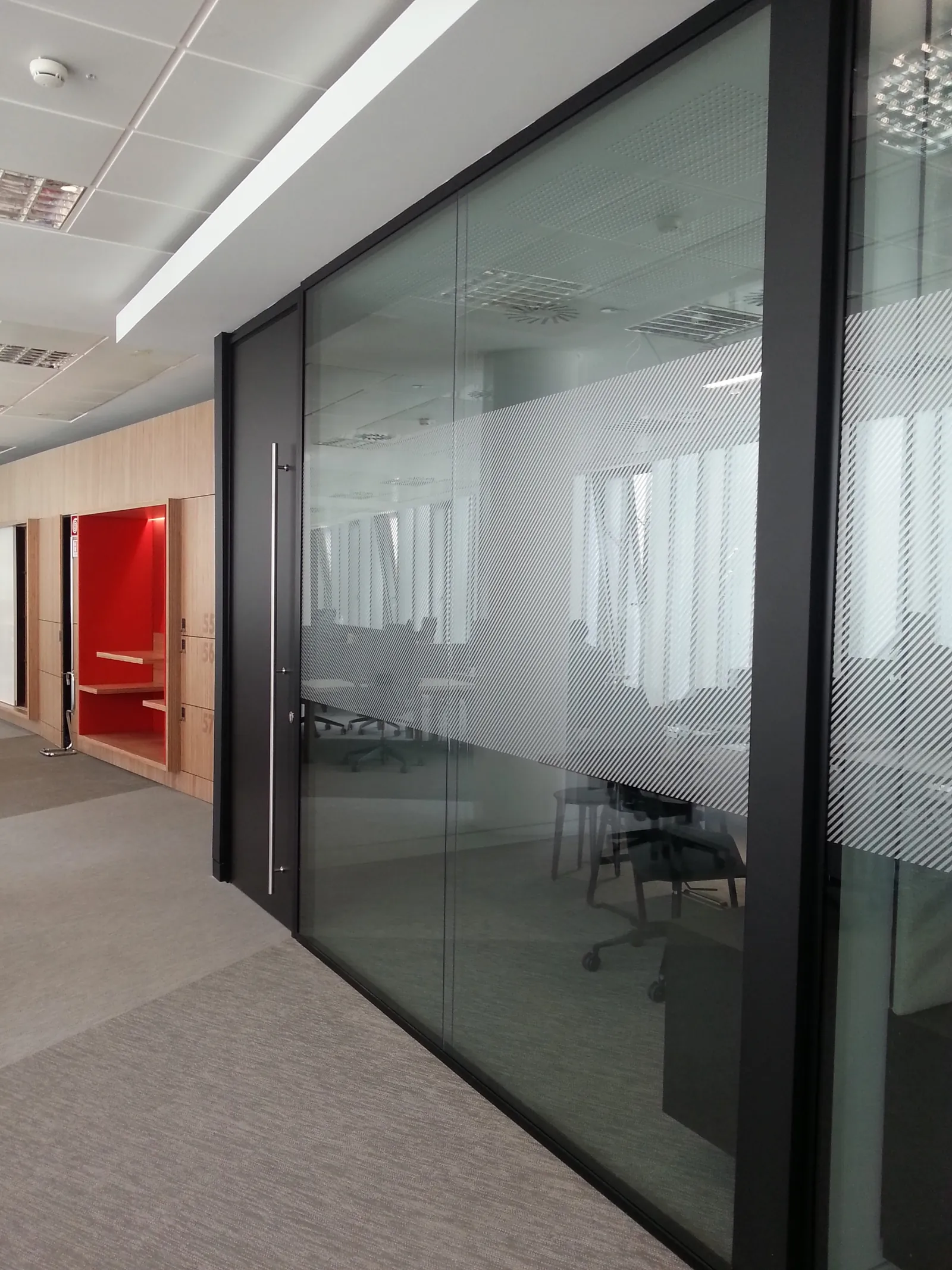 Dark-Frame Glass Office Front Dark-framed double glazed office front with full-height glass door and decorative film