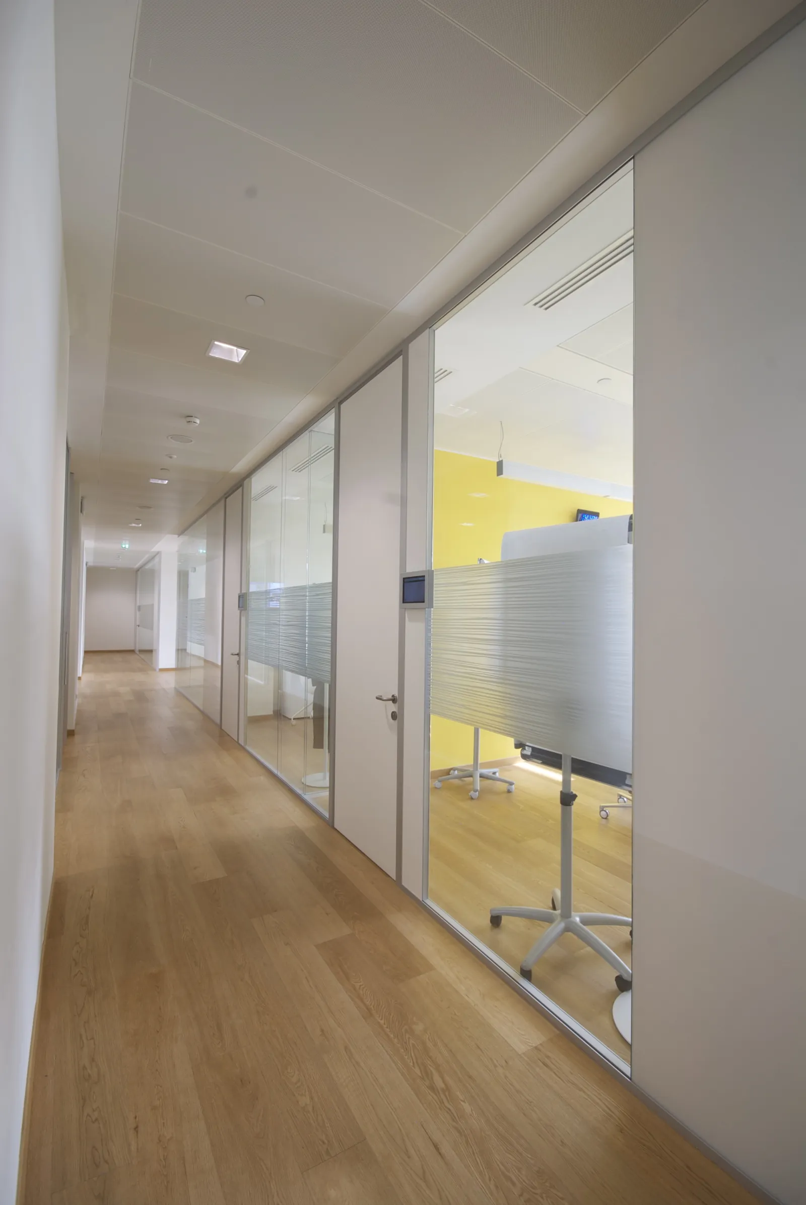 Double Glazed Office Corridor Corridor of double glazed private offices with frosted graphic film