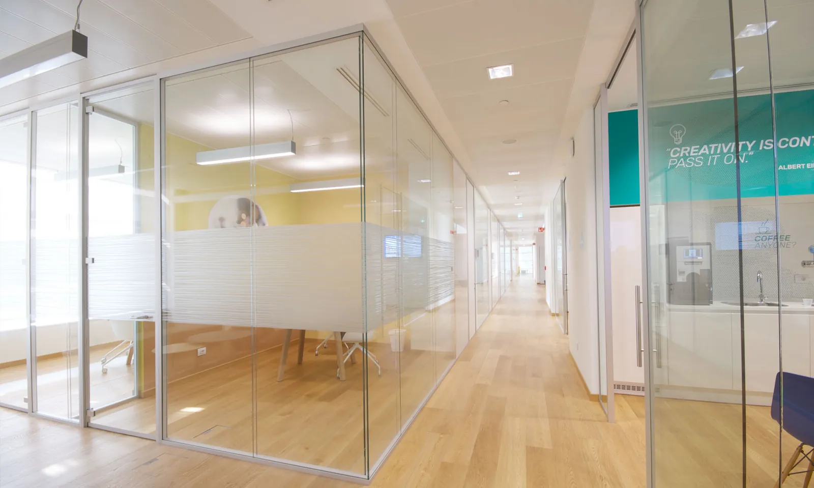 Glass-Walled Corridor Glass-walled corridor with double glazed offices and wood floors